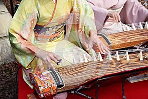 Japanese woman playing the traditional instrument
