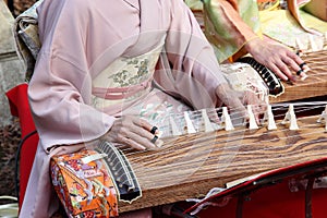 Japanese woman playing the traditional instrument