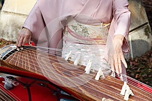 Japanese woman playing the traditional instrument