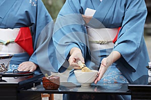 Japanese woman preparing green tea ceremony