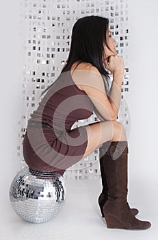 Japanese woman sits on glitterball