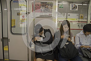 Japanese Woman Sleeping At An Osaka Subway Train At Japan 2016