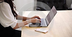 A Japanese woman typing laptop by remote work in the office faceless composition