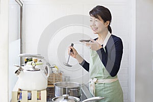 Japanese women tasting dishes