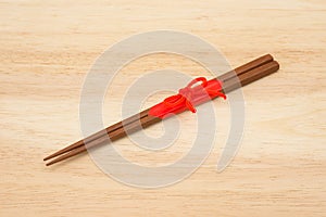 Japanese wooden chopsticks wrapped in red paper and red rope on