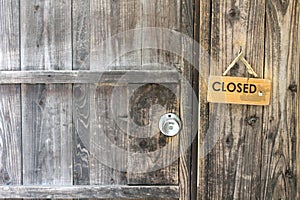 Japanese wooden door sign saying closed