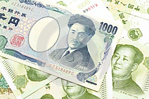 A Japanese yen bank note with Chinese one yuan bills