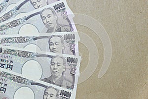 Japanese yen on brown paper background