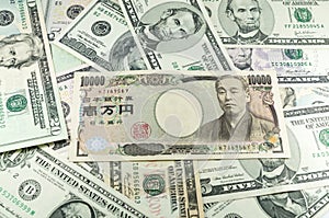 Japanese yen notes on many dollars background