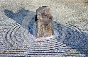 Japanese zen landscape garden, or karesansui, with raked sand or gravel to represent ripples in water. Kurikarafudoji