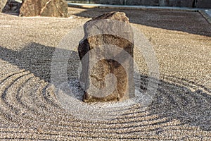 Japanese zen landscape garden, or karesansui, with raked sand or gravel to represent ripples in water. Kurikarafudoji