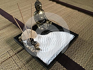 Japanese zen tray garden with bronze buddha statue