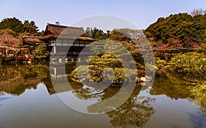 Japanise garden over the lake in the Heian Shrine in Kyoto, Japan.