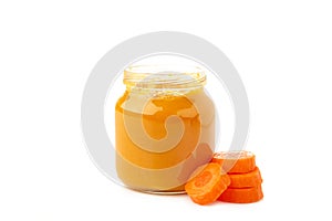 Jar of baby puree with carrot isolated on white background. Vegetable puree