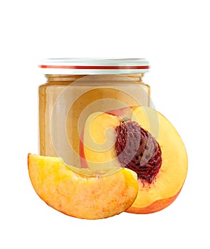 Jar of baby puree and peach slice isolated on white