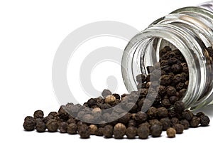 A jar of black peppercorns.