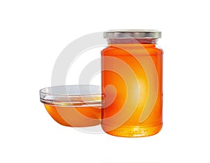 Jar and bowl of olive honey. Isolated