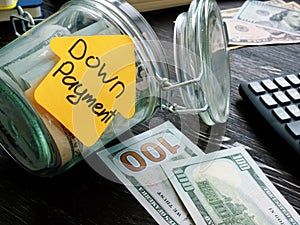 Jar and cash for mortgage with sign down payment.