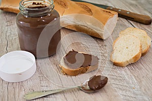 Jar of chocolate nut spread and baguette slices