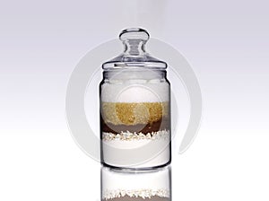 Jar with chocolate, sugar, brown sugar, flour, cocoa