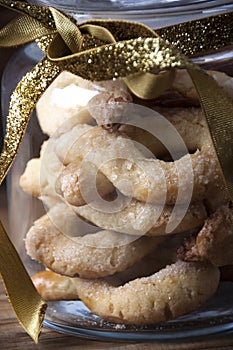 Jar of Christmas cookies with golden ribbon