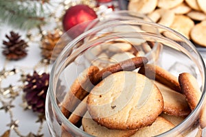 Jar of cookies with pinecones and christmas toys