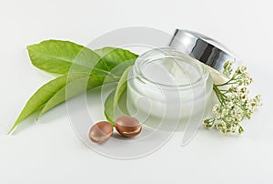 Jar of cream for skincare with argan nuts