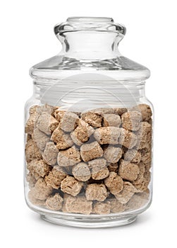 Jar of extruded oats bran pellets
