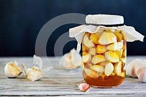 Jar of Fermented Garlic Cloves in Honey