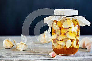 Jar of Fermented Garlic Cloves in Honey photo