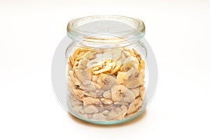 A jar filled with dry bananas