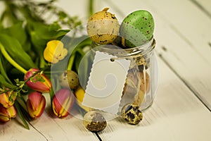 Jar filled with easter eggs and a badge with free text space