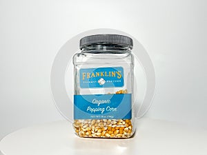 A jar of Franklins Gourmet Popcorn on a white background