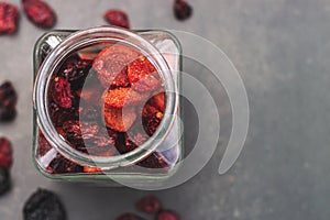 Jar full of berries, with black background