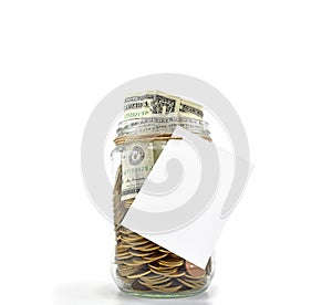 Jar full with coins and dollars with white paper ready for your message on white background Concept: Saving Money, Money Grow