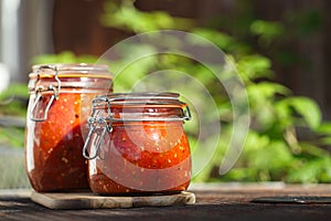Jar of home made classic spicy Tomato salsa photo