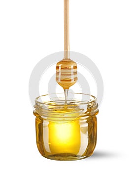 Jar of honey and dipper
