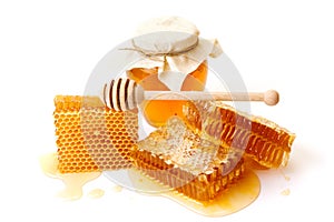 Jar of honey with honeycombs