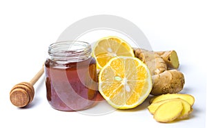 Jar of honey and lemon gingers isolated on white