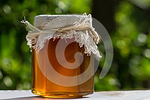 Jar with honey on table