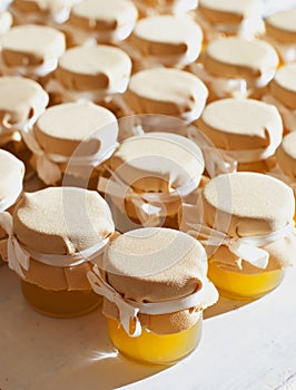 Jar of honey on white table jam