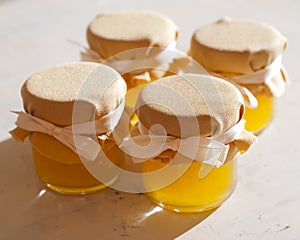 Jar of honey on white table jam