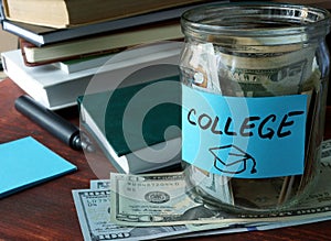 Jar with label college and money on the table.