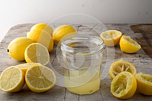 A Jar of Lemon Juice with Lemons