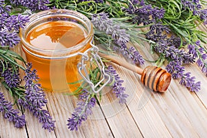 Jar of liquid honey with lavender