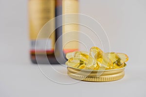 Jar with omega 3 capsules in a cap on a white background