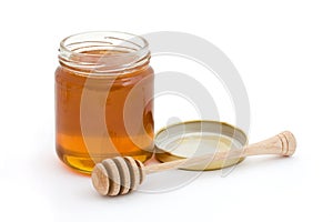 Jar of open honey with drizzler photo