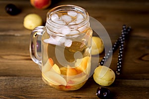 Jar of Peach Ice Tea with Fresh Fruits on a Rustic Wooden Background Tasty Fresh Summer Drink Above