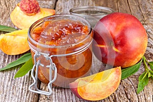 Jar with peach jam photo