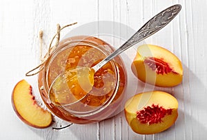 Jar of peach jam photo